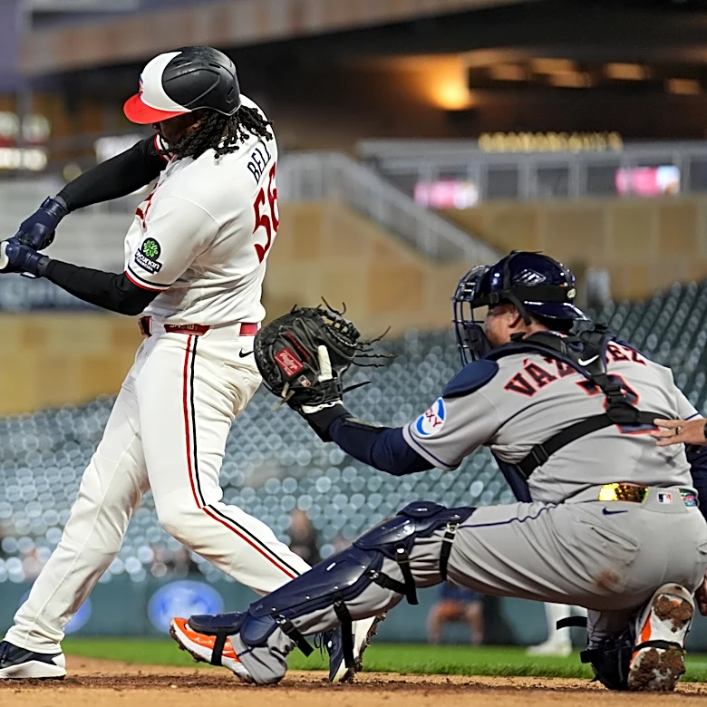 Josh Bell homers twice as Twins beat Astros 6-3 in game delayed nearly 2 hours by rain