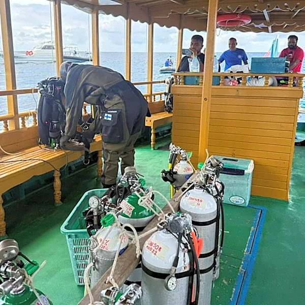 Finnish divers recover 2 of the dead Italians from an underwater cave in the Maldives