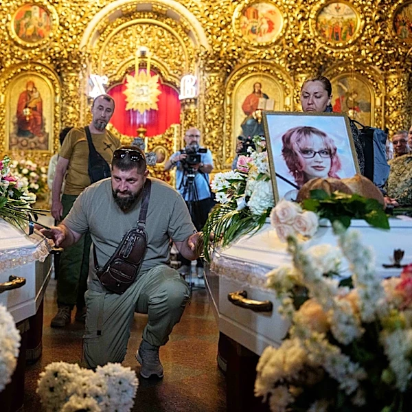 Kyiv holds a funeral for 2 young sisters killed by a Russian missile strike