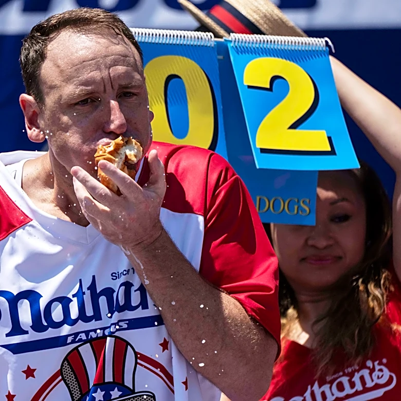Joey Chestnut to defend hot dog eating title while on probation after pleading guilty to battery