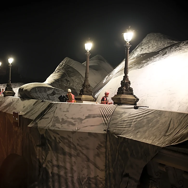 French artist JR begins his giant ‘cave’ art inflation over Paris’ oldest bridge