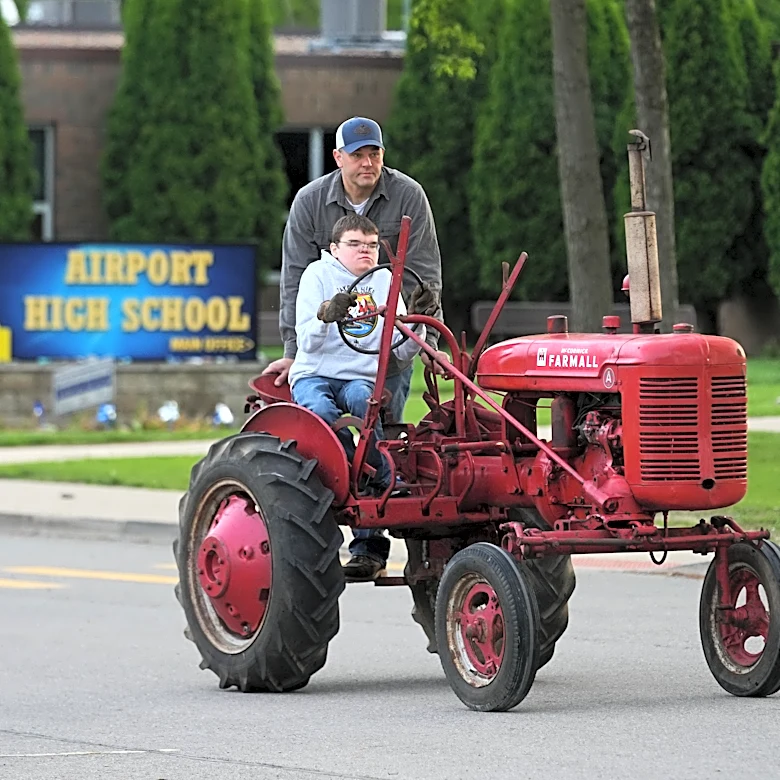 Tractors, ATVs and golf carts, oh my: Michigan seniors arrive at school in style on Tractor Day