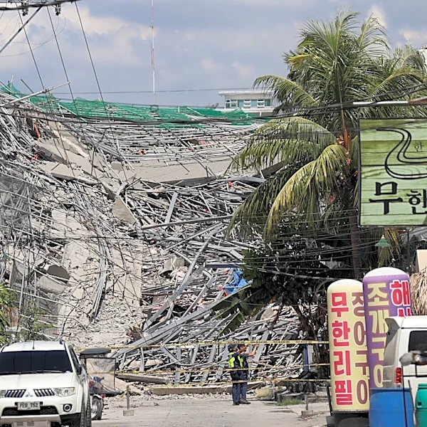 A 9-story building under construction in Philippines collapses, possibly trapping dozens of workers