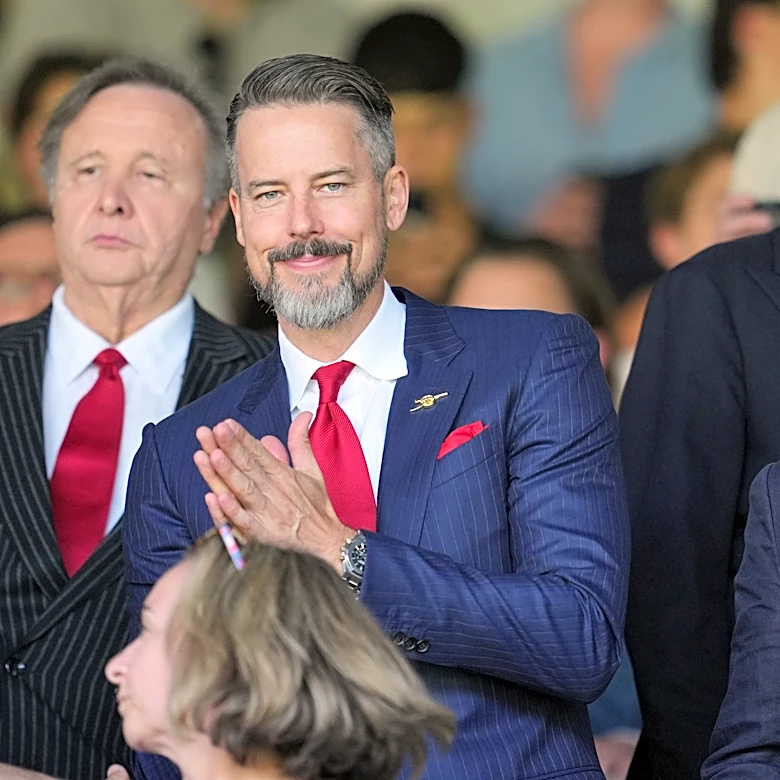Kroenkes watch on as Arsenal's players finally get their hands on the Premier League trophy