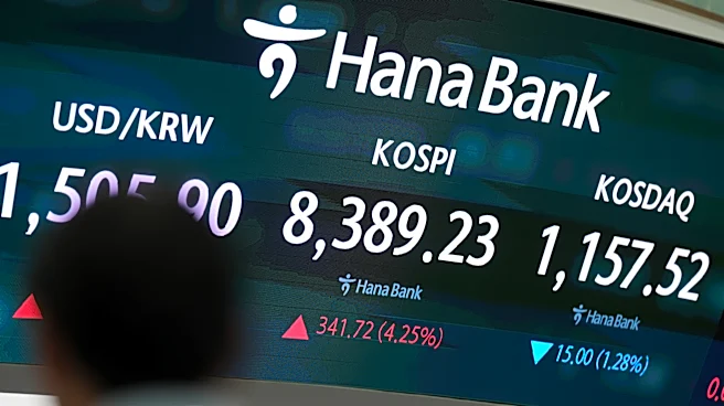 Asian shares are mostly higher, tracking Wall Street's fresh records, and oil prices fall