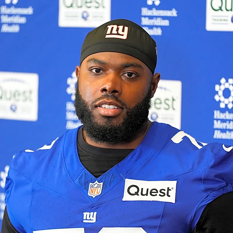 Giants restructure left tackle Andrew Thomas' contract to clear cap space, AP source says