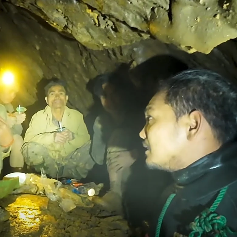 Rescuers free 4 men who remained trapped in a flooded Laos cave, search for 2 still missing