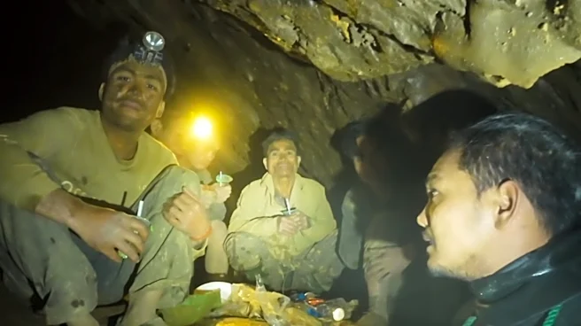 Rescuers free 4 men who remained trapped in a flooded Laos cave, search for 2 still missing