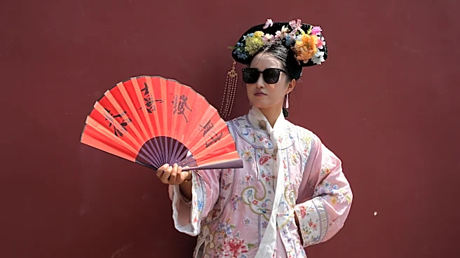 Dressing visitors in ancient China's imperial splendor is booming in Beijing