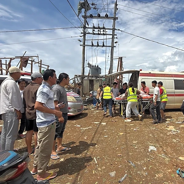 Rescuers dig for bodies after a mining explosives blast in Myanmar kills at least 43