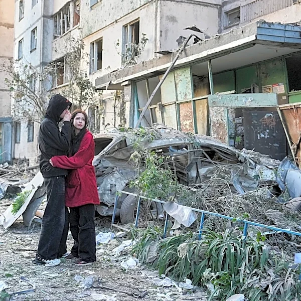Russian attack on Ukraine kills at least 11 and traps others in damaged buildings