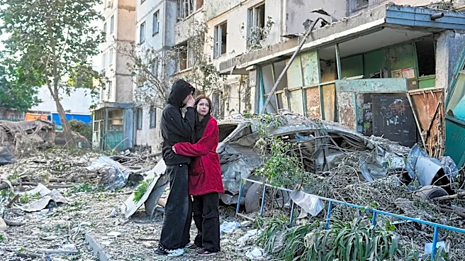 Russian attack on Ukraine kills at least 11 and traps others in damaged buildings