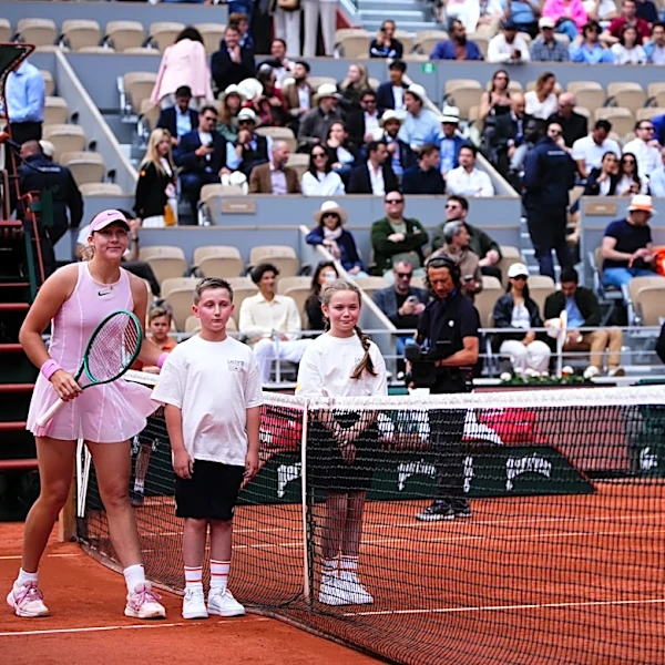 Kostyuk of Ukraine and Andreeva of Russia pose separately for pre-match photo at French Open