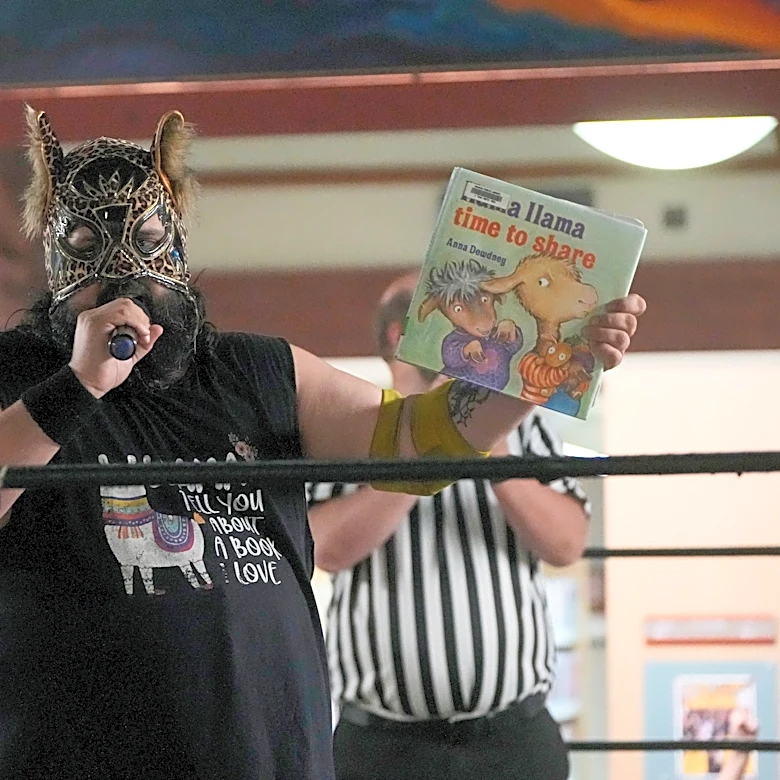 Wrestling matches provide an action-packed story time at US libraries, in photos