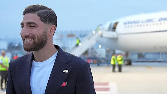 Iran's World Cup players wear pins for victims of deadly strike on school as they arrive in Mexico