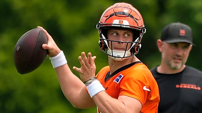 Bengals restructure Joe Burrow's contract to free up cap space, AP source says
