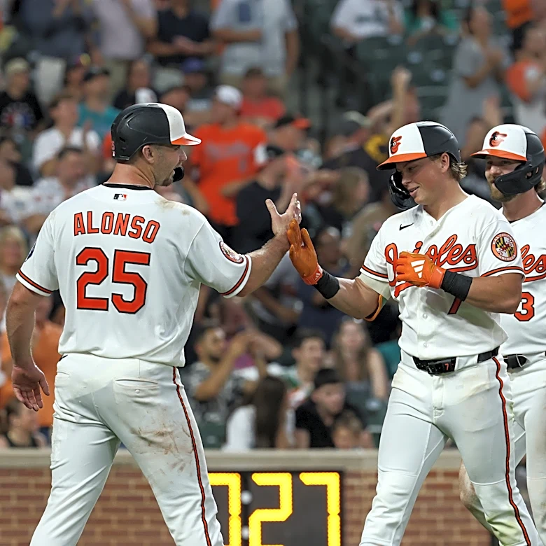 Holliday hits grand slam and Young pitches Orioles past Mariners 7-2 to stop 4-game slide