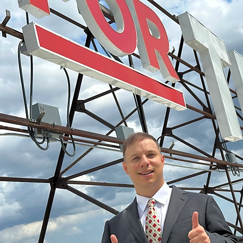 Can the man behind a giant pro-Trump sign ride the president’s praise to Congress?