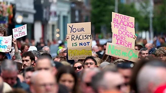 Thousands rally in Belfast to condemn anti-immigrant rioting that followed stabbing