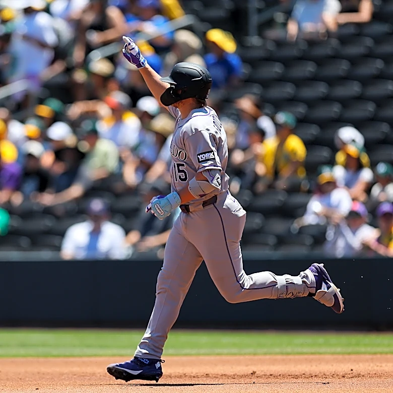 Rockies set club record for runs with 23-9 victory over A's in Las Vegas heat