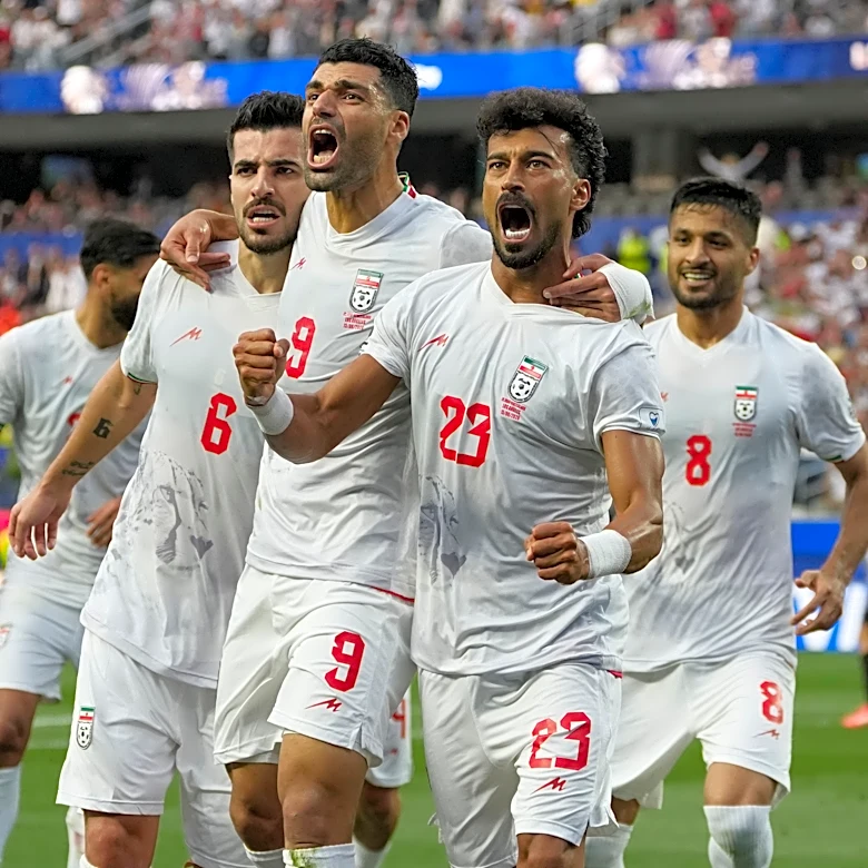 Iran opens its politically charged World Cup by playing to a 2-2 draw with New Zealand