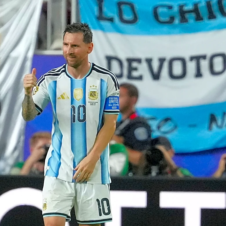 Messi has his first World Cup hat trick as defending champion Argentina beats Algeria 3-0 in opener