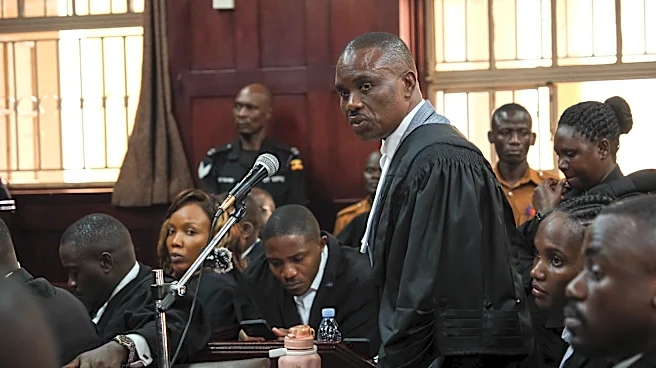 Uganda court charges lawyer for jailed Ugandan opposition leader with concealing treason