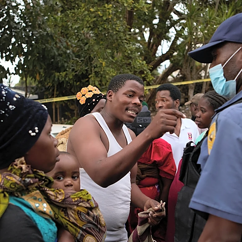 Migrants clash with police at a deportation site in South Africa where thousands have gathered
