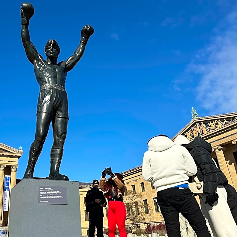 Brazilian soccer fans at the World Cup heed warning not to dress Rocky statue in team gear