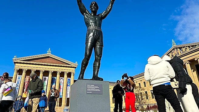 Brazilian soccer fans at the World Cup heed warning not to dress Rocky statue in team gear