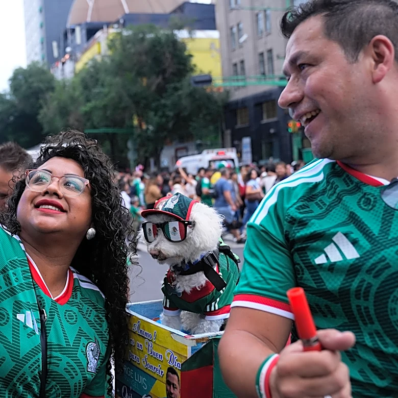 Rescue dog Osito steals hearts at the World Cup, one bike ride at a time