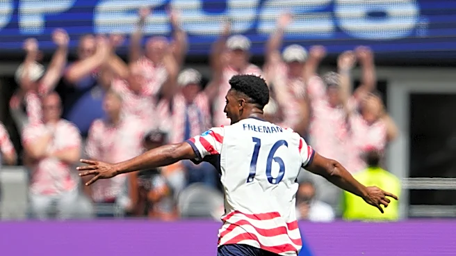 US reaches World Cup knockout round and wins its group with 2nd straight victory, 2-0 over Australia