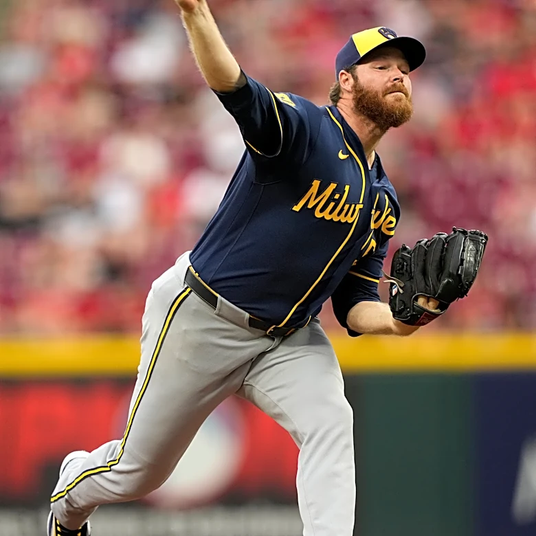 Woodruff's stellar return and Ortiz's sacrifice fly in 10th lift Brewers to 2-1 win over Reds