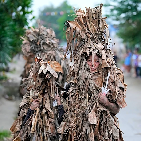 Philippine devotees honor St. John the Baptist with a mud-covered display of faith