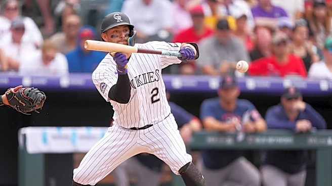 Freeman's bunt drives in go-ahead run, Carrigg has 3 RBIs as Rockies rally past Red Sox 8-6