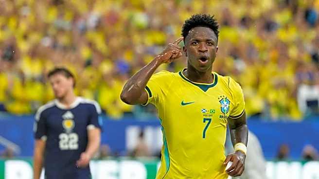 Vinícius Júnior scores 2 goals as Brazil beats Scotland 3-0 to reach World Cup knockout stage