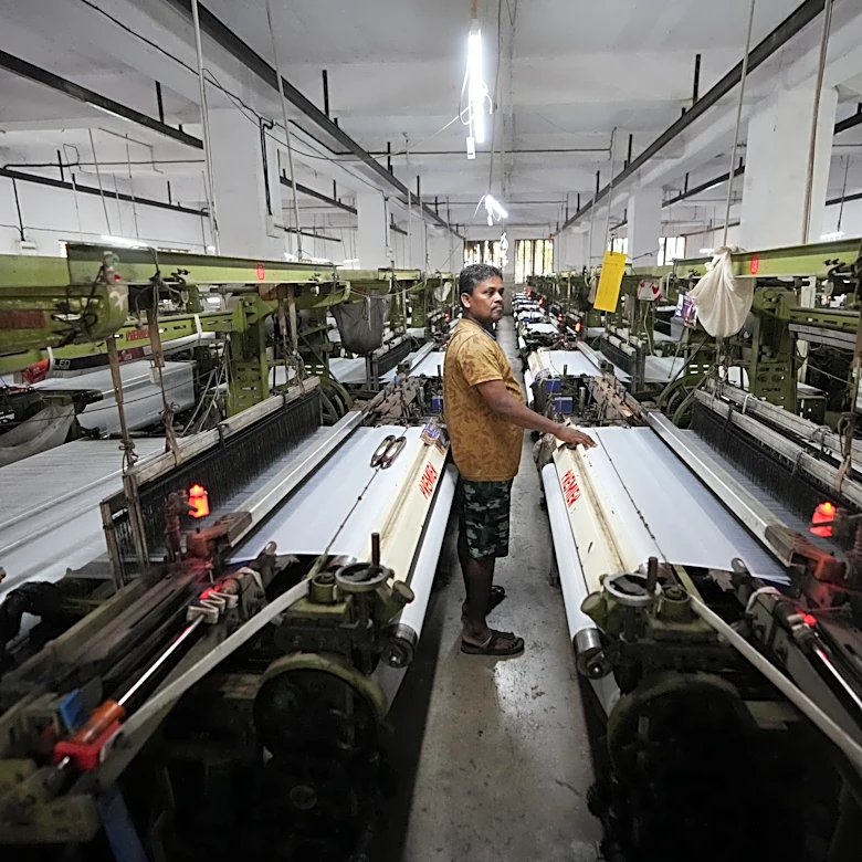 How one Indian textile worker copes with extreme heat in factory work and cramped living quarters