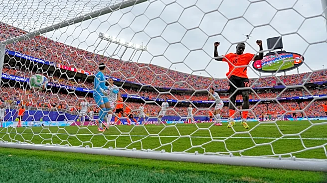 Brian Brobbey and the Dutch roll in the rain to a 3-1 win over Tunisia to top World Cup Group F