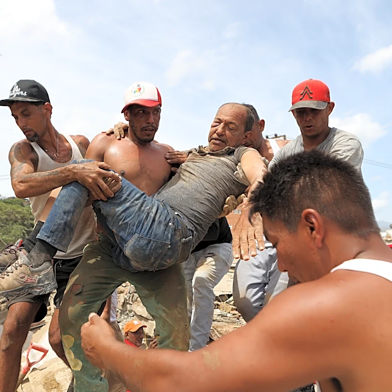 Neighbors dig through Venezuela rubble to search for loved ones as death toll climbs