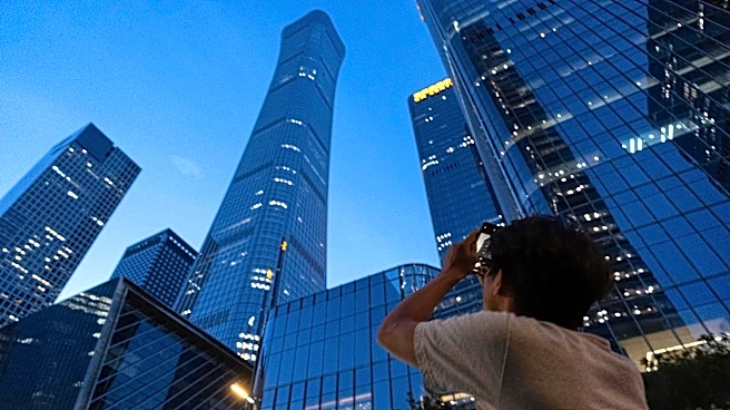 A small plane has crashed into a Beijing high-rise, killing the pilot and injuring 13