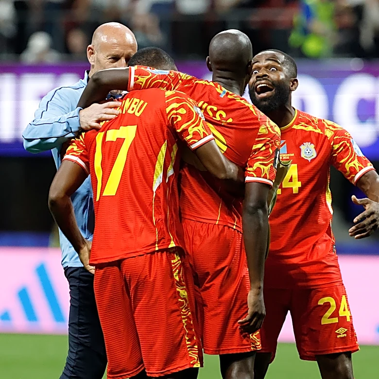 Congo rallies to a 3-1 win against Uzbekistan to seal place in the World Cup knockouts
