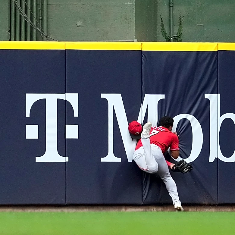 Reds' Dane Myers taken to the hospital after he crashed into the wall
