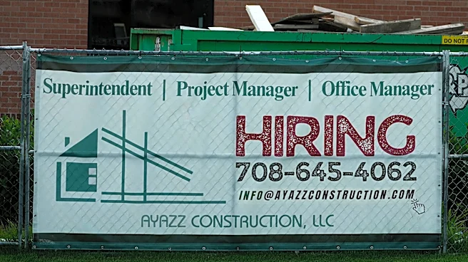 U.S. filings for jobless aid fall to 215,000 as layoffs remain at historically healthy levels