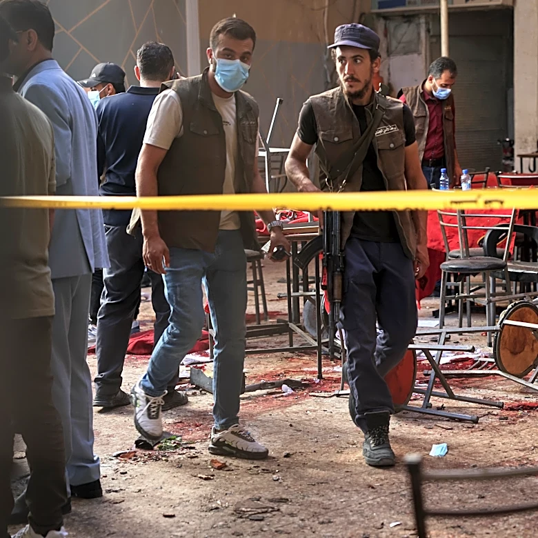 Explosive device goes off in cafe in Syria's capital, killing at least 9 people