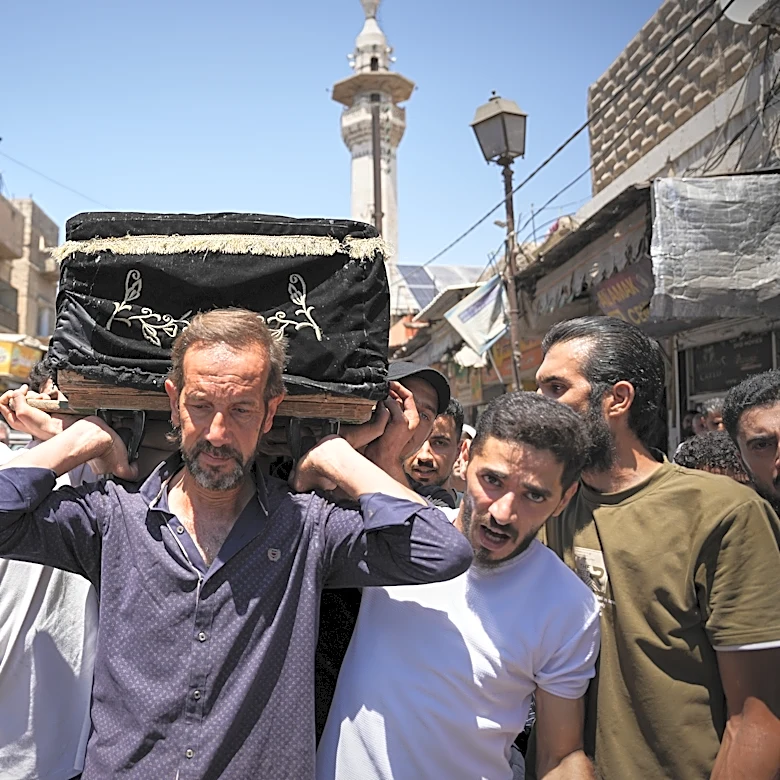 Mourners in Damascus bury cafe blast victims as officials promise justice