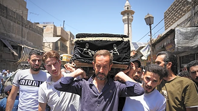 Mourners in Damascus bury cafe blast victims as officials promise justice
