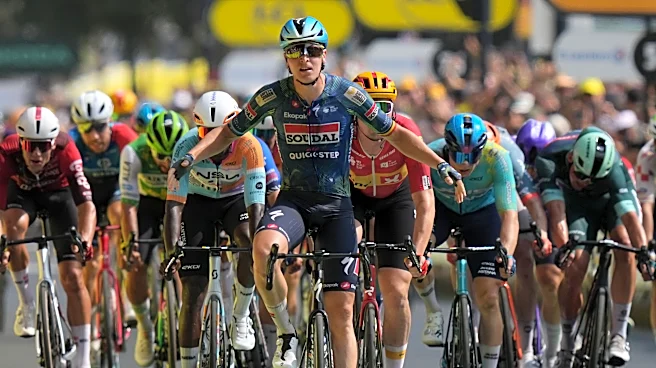Belgian rider Merlier wins stage 7 as Tour favorite Pogacar keeps the yellow jersey