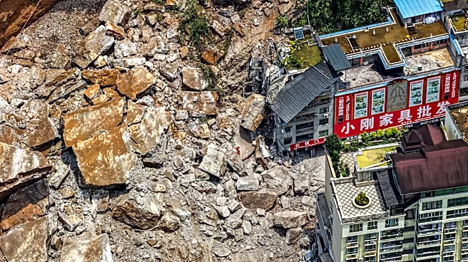 A huge landslide in southwest China buries homes and force more than 1,000 to evacuate