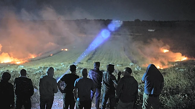 Photos show West Bank Palestinians keeping watch at night as settler violence grows
