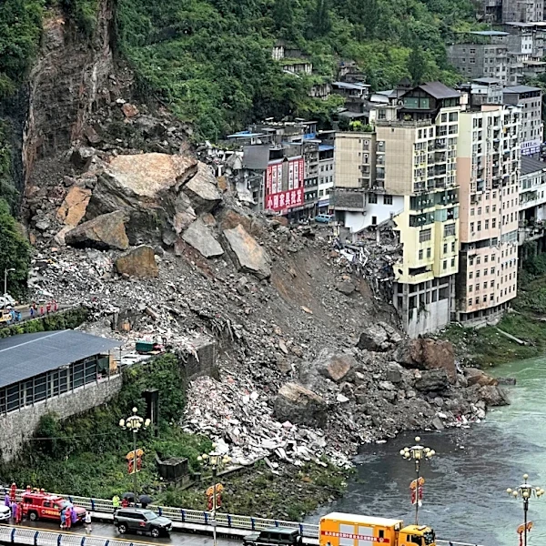Rescuers race to find survivors in the rain after a landslide in China kills at least 8